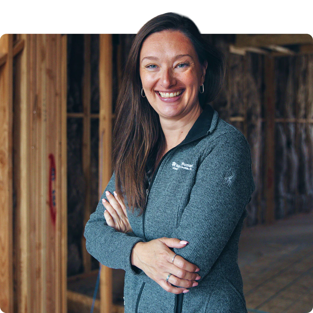 A smiling woman standing in a building, featured as Habitat for Humanity customer from Park City, UT.